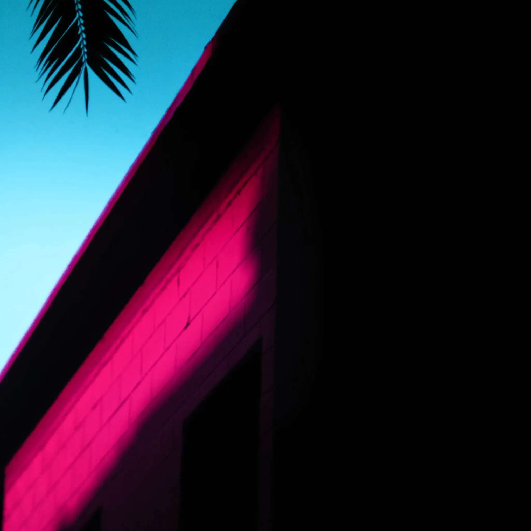 Close crop of a red-brick and steel warehouse facade in inner-city Johannesburg at blue hour, clean geometry, no signs or lettering