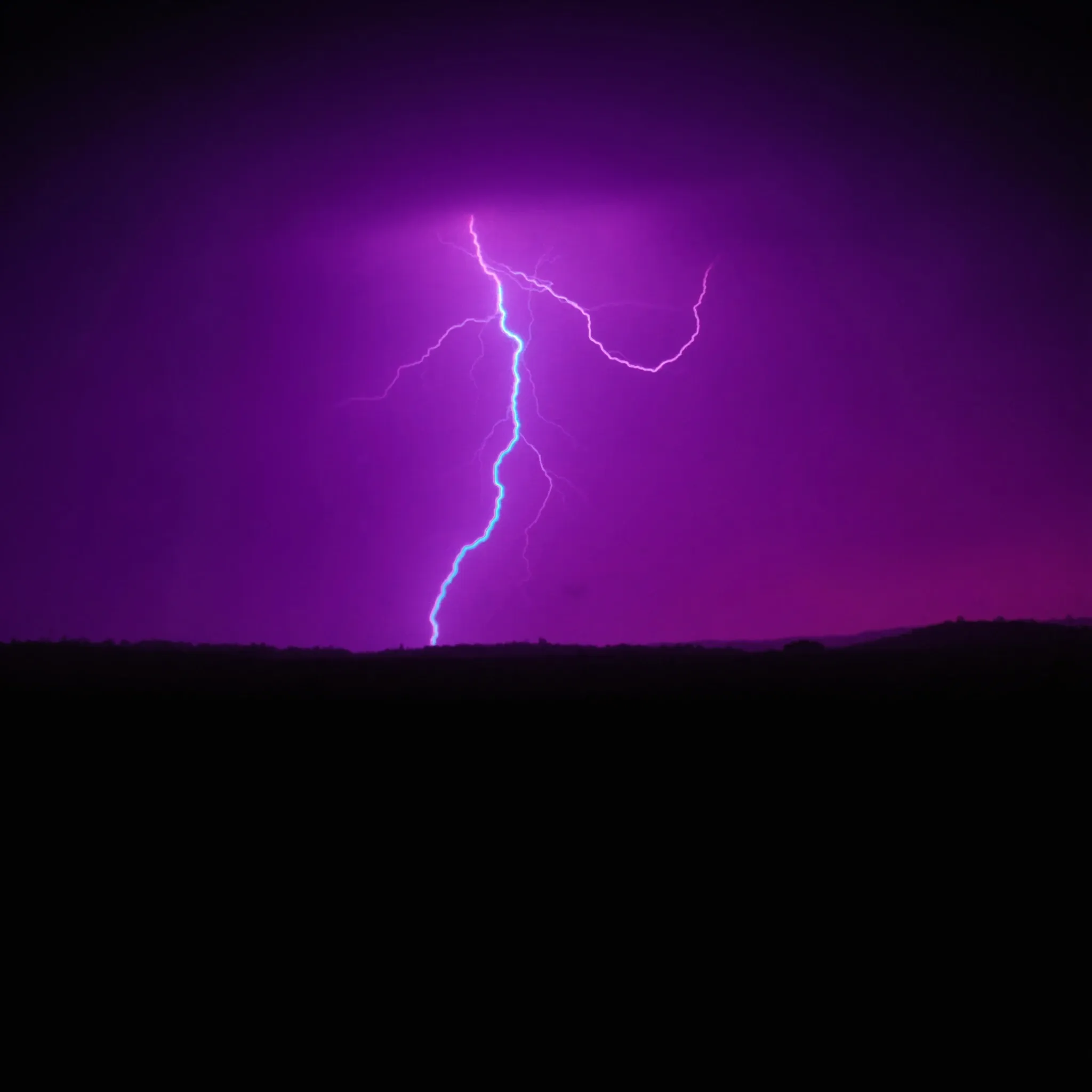 A highveld thunderstorm at night, lightning over Johannesburg, a purple sky
