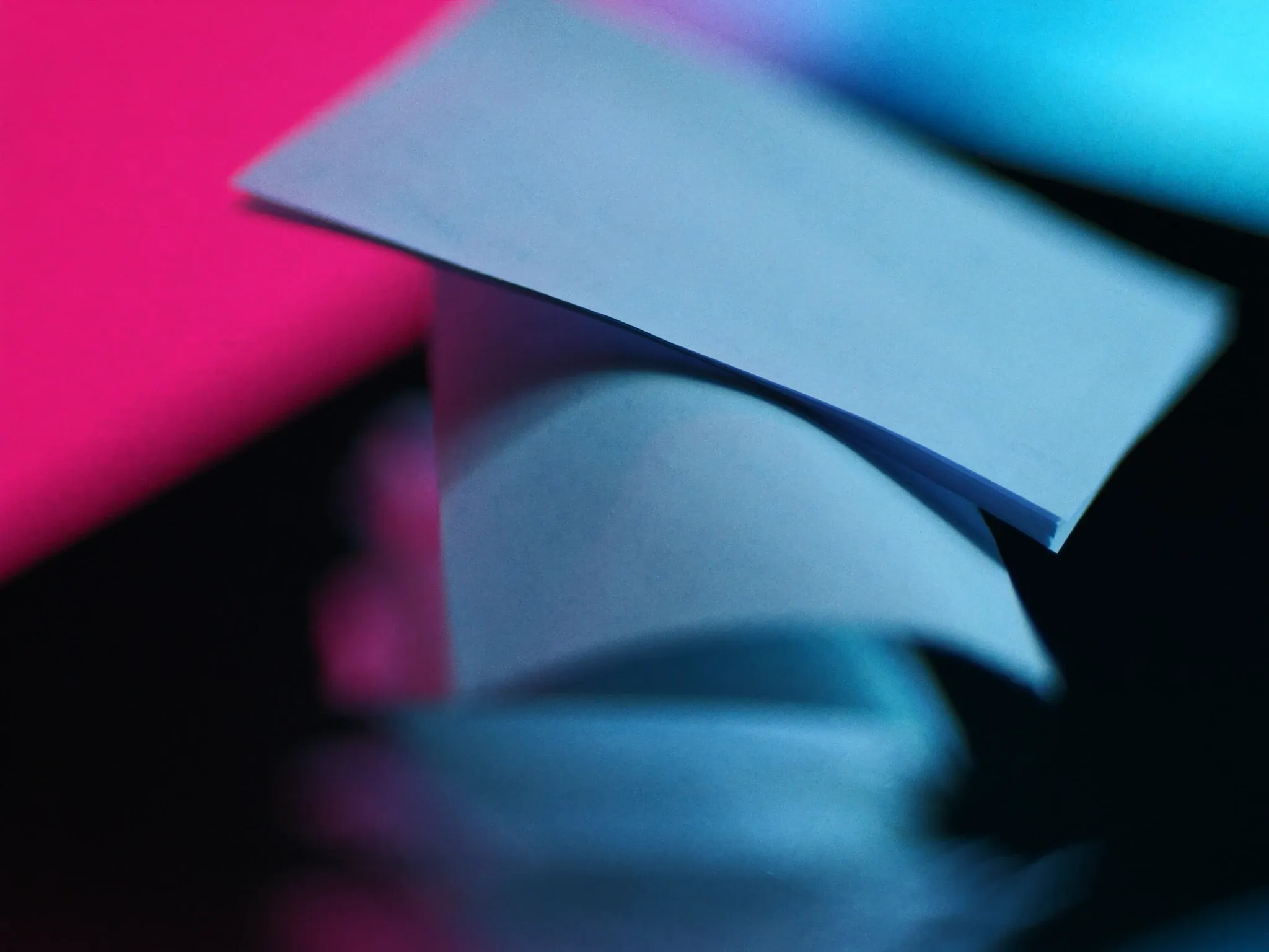 Precarious stacks of blank paper toppling in a dim archive, sheets sliding off the top