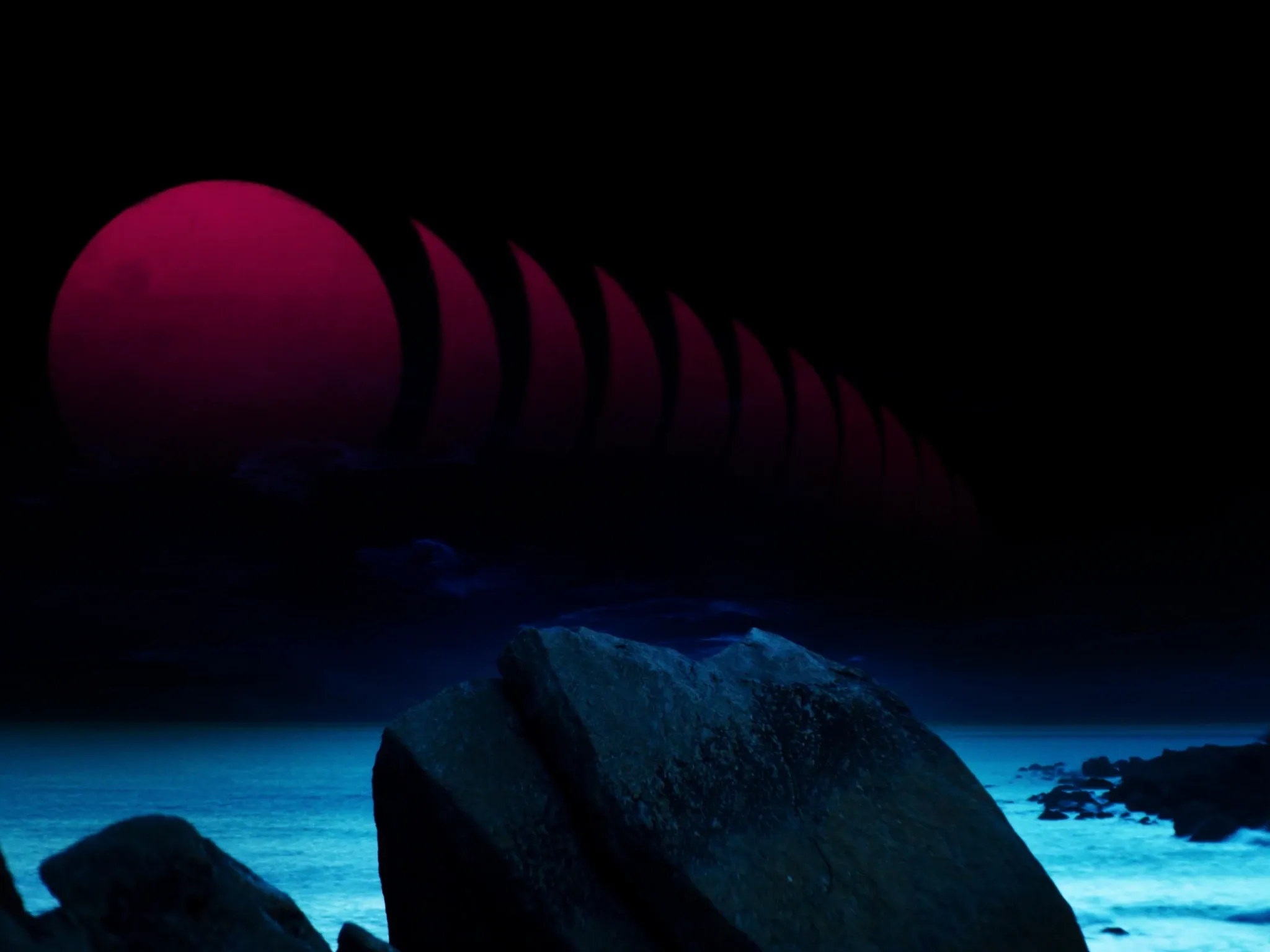 The moon rising over the Atlantic from the boulders at Camps Bay, Cape Town, a multi-exposure tracing its steady path over a calm sea