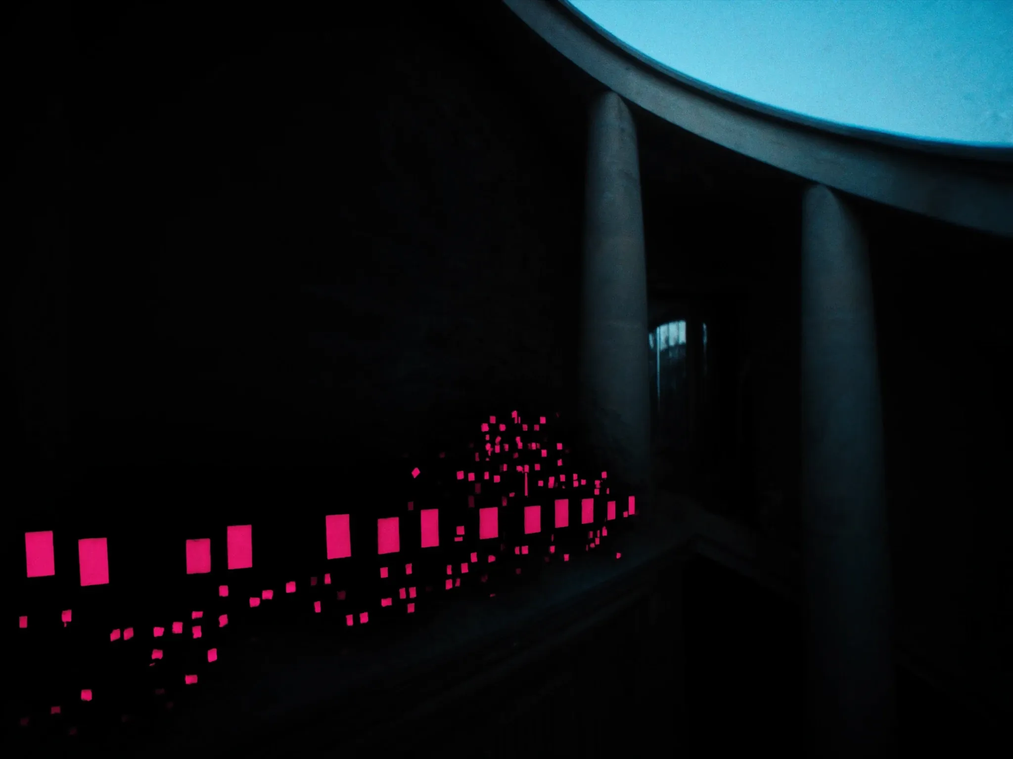 The sandstone colonnades of a grand government building in Pretoria at blue hour, softly lit, clean architectural lines, no people, no flags, no lettering