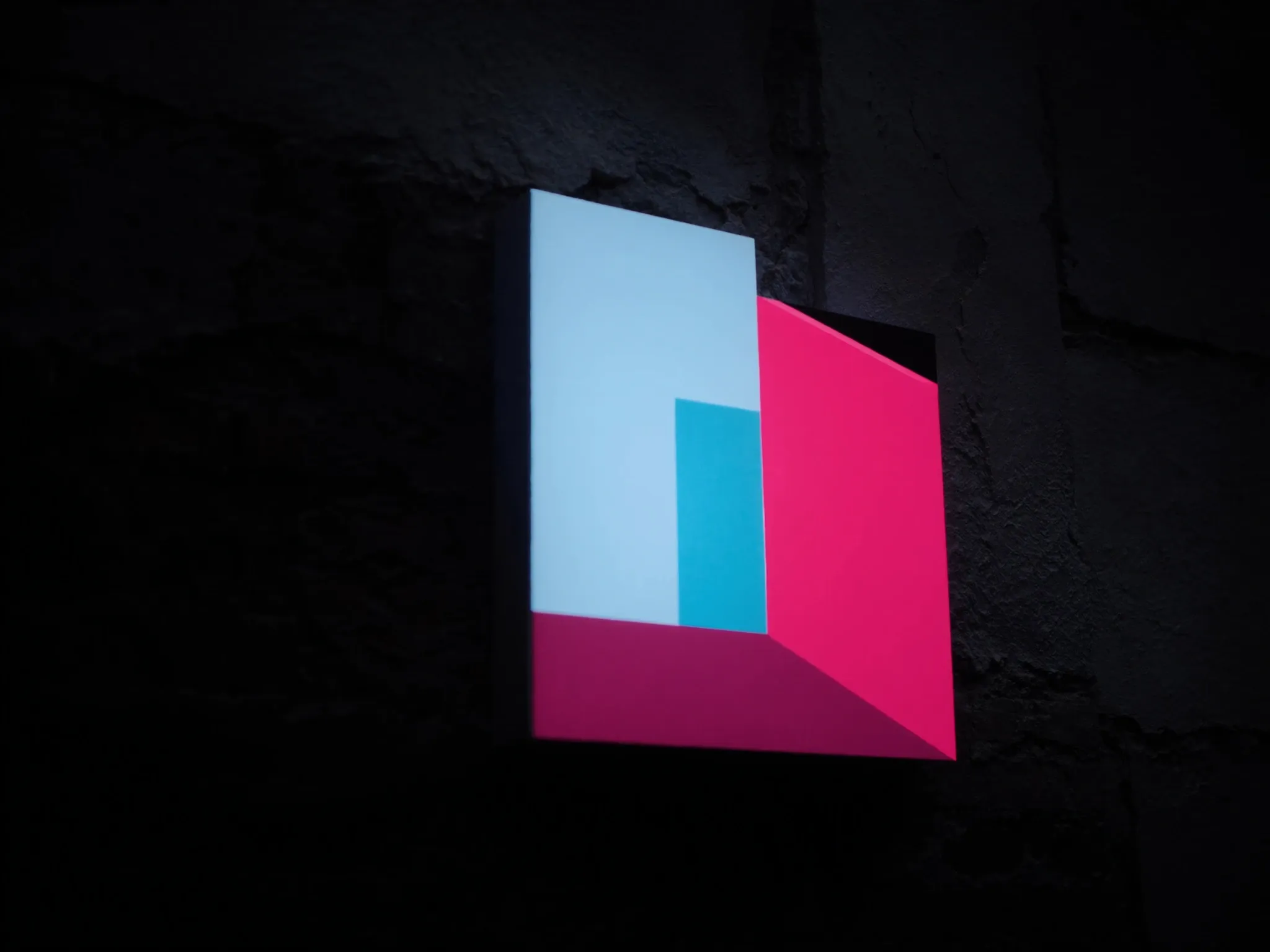 A weathered old wall with a clean new geometric panel of light set into it, architectural and minimal