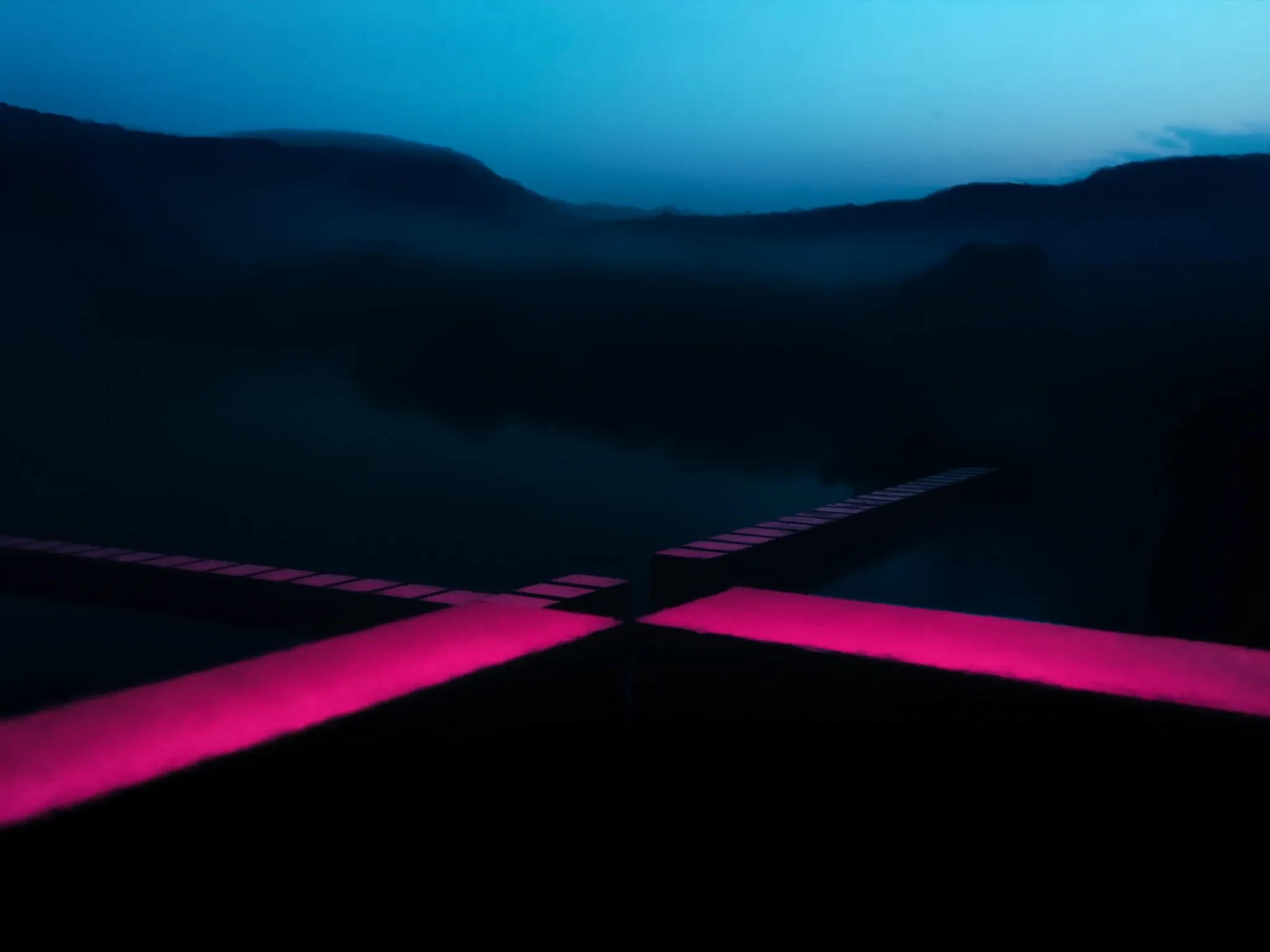 Two lines of stepping stones crossing a still, misty river toward the same shore, blue hour