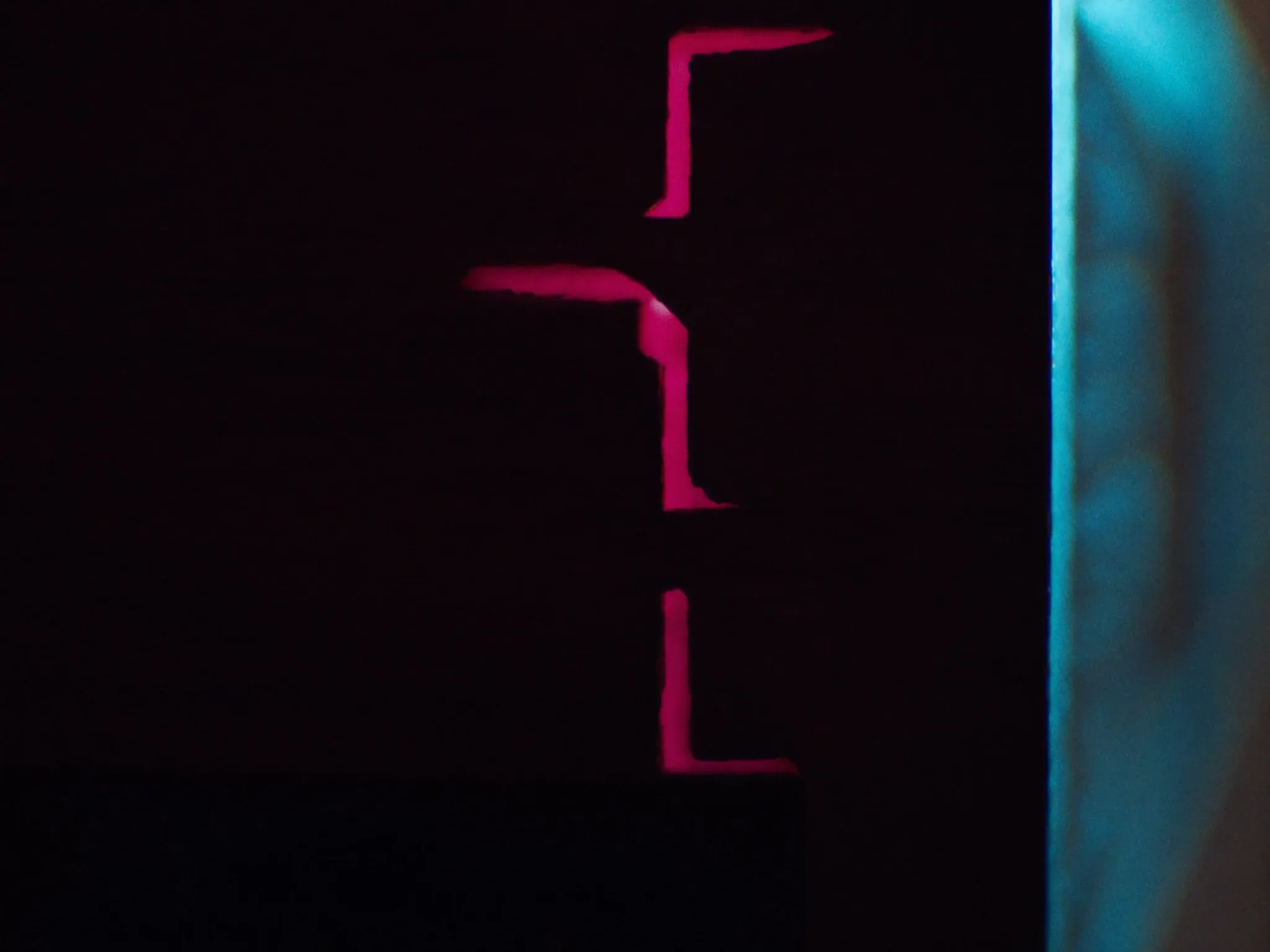 Macro of a precise dovetail joint in dark timber, the interlocking tails and pins clearly visible, warm raking side light